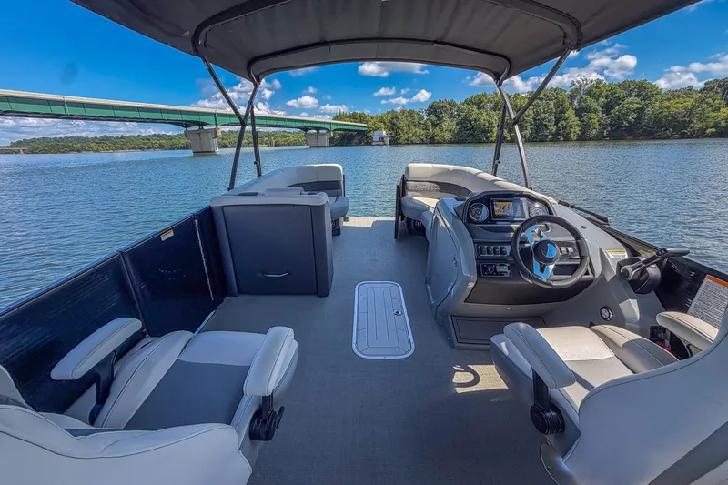 Slide: The Image of 2021 Godfrey Monaco 235 pontoon boat on a scenic lake with bridge view. - 38