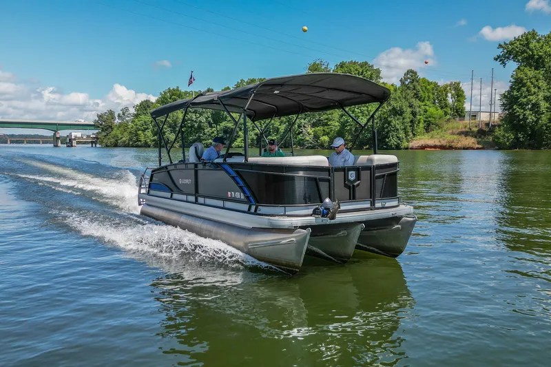 Slide: The Image of 2021 Godfrey Monaco 235 pontoon boat cruising on a scenic river. - 8