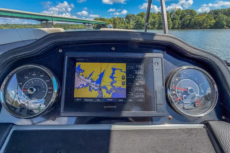 Slide: The Image of Dashboard of a 2021 Godfrey Monaco 235 boat with Garmin GPS display. - 36