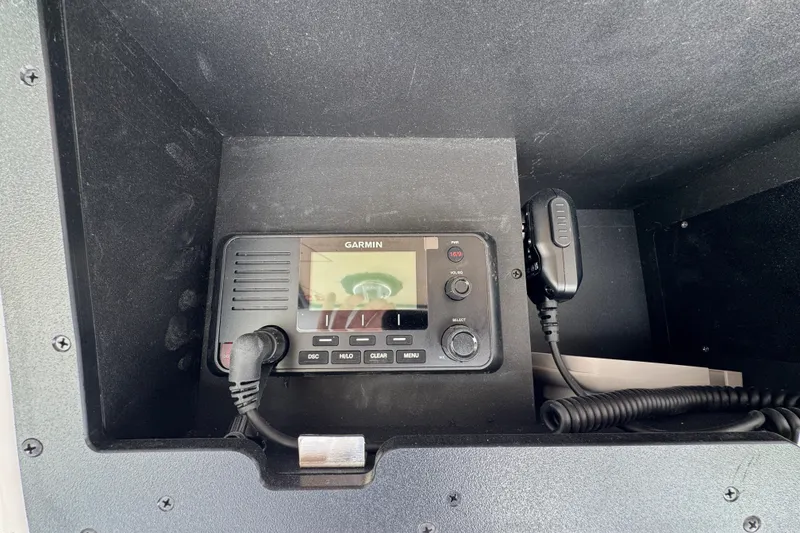 Slide: The Image of Garmin marine radio installed in a 2027 Caymas 291 boat console. - 35