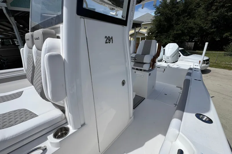 Slide: The Image of 2027 Caymas 291 boat with sleek white design and comfortable seating. - 25