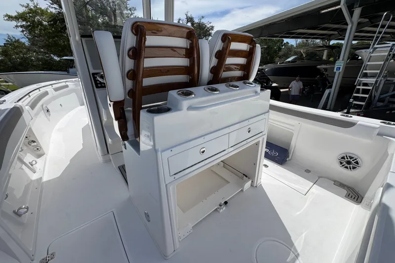 Slide: The Image of 2027 Caymas 291 boat interior with sleek seating and storage compartments. - 37