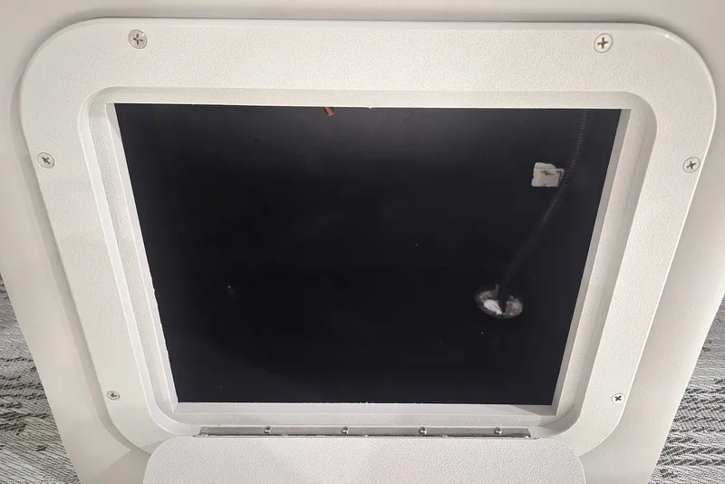 Slide: The Image of Hatch opening of 2026 Sylvan X3 DLZ DH BAR boat, showcasing interior compartment. - 13