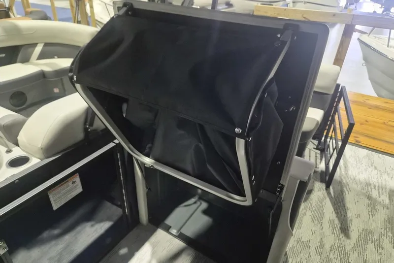 Slide: The Image of 2026 Sylvan X3 DLZ DH BAR interior with seating and storage compartment. - 8
