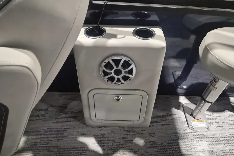 Slide: The Image of Interior of 2026 Sylvan X3 DLZ DH BAR boat with speaker and seating. - 12