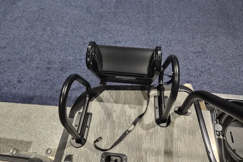 Slide: The Image of 2026 Sylvan X3 DLZ DH BAR boat seating with black metal frame and textured flooring. - 19