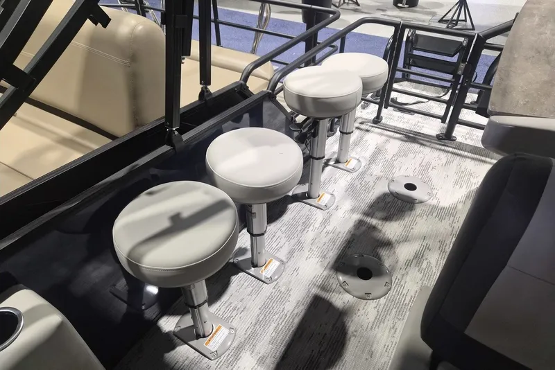 Slide: The Image of Four bar stools on a 2026 Sylvan X3 DLZ DH BAR boat deck. - 11