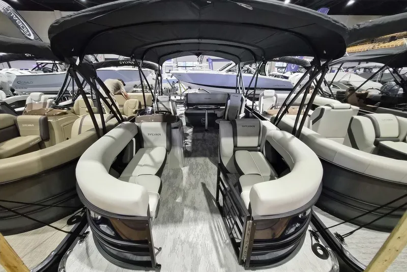 The Image of 2026 Sylvan X3 DLZ DH BAR pontoon boat with luxurious seating and canopy. - 0
