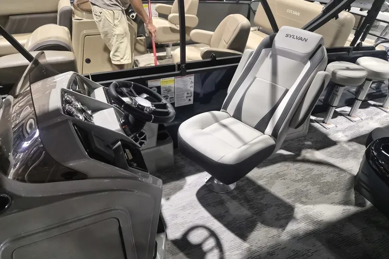 Slide: The Image of 2026 Sylvan X3 DLZ DH BAR boat interior with modern steering and seating. - 5