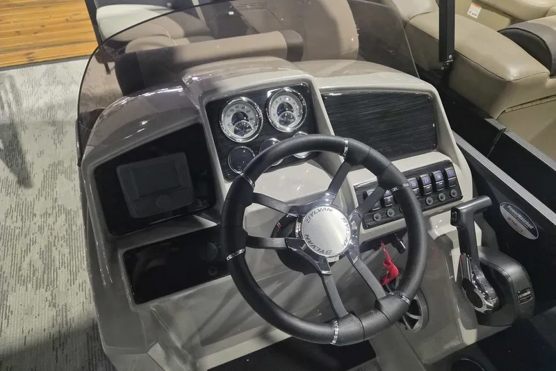 Slide: The Image of Steering console of 2026 Sylvan X3 DLZ DH BAR boat with gauges and controls. - 6