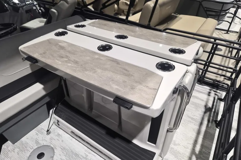 Slide: The Image of Interior of 2026 Sylvan X3 DLZ DH BAR boat with modern seating and table setup. - 17