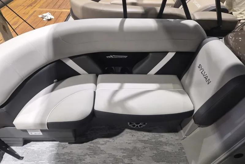 Slide: The Image of Luxurious seating on 2026 Sylvan X3 DLZ DH BAR pontoon boat, featuring sleek design and comfort. - 2