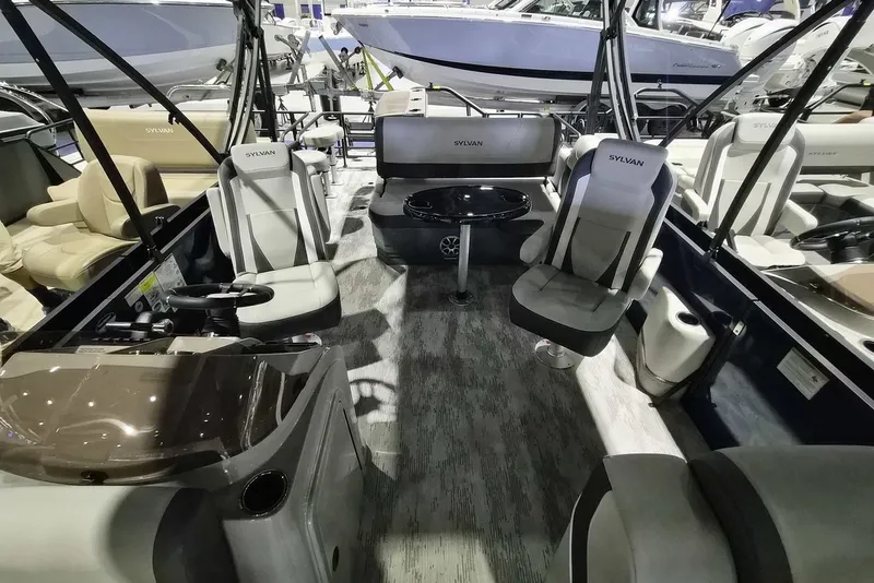Slide: The Image of Interior of 2026 Sylvan X3 DLZ DH BAR pontoon boat with luxurious seating and modern design. - 4