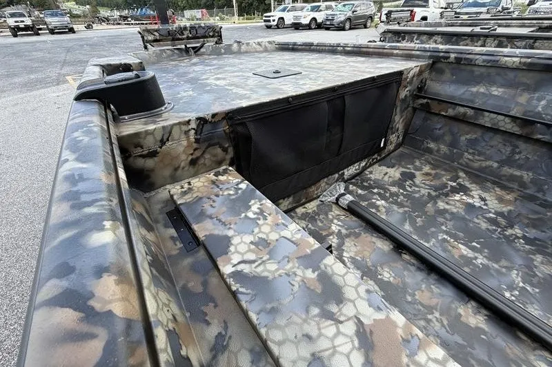 Slide: The Image of 2027 Excel 1751 Viper F4 boat with camouflage design in a parking lot. - 13