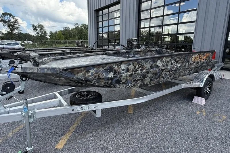 The Image of 2027 Excel 1751 Viper F4 boat with camouflage design on a trailer. - 0