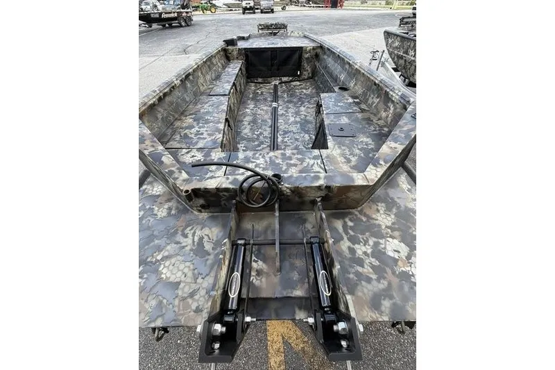 Slide: The Image of Camouflage-patterned 2027 Excel 1751 Viper F4 boat interior, featuring spacious seating and storage. - 15