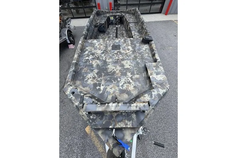Slide: The Image of Camouflage-patterned 2027 Excel 1751 Viper F4 boat parked outdoors. - 7