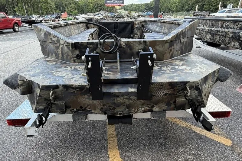 Slide: The Image of 2027 Excel 1751 Viper F4 boat with camouflage design on a trailer. - 12
