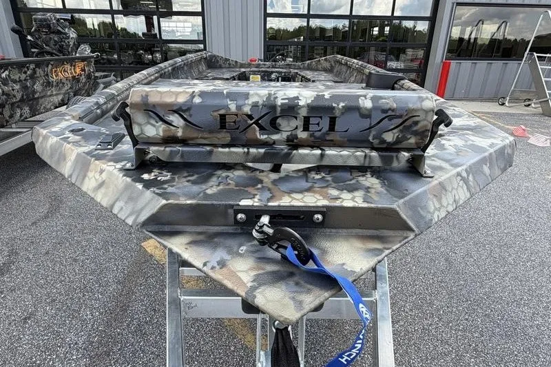 Slide: The Image of 2027 Excel 1751 Viper F4 boat with camouflage design on a trailer. - 14