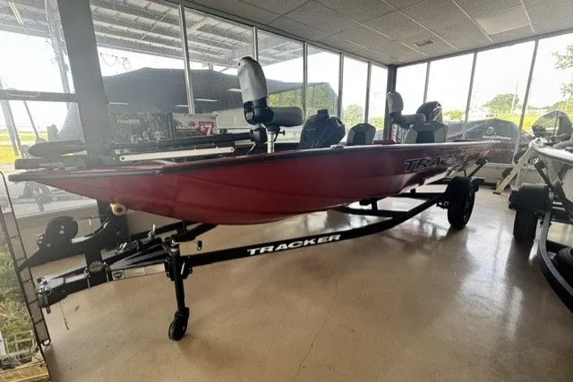 The Image of 2027 Tracker Pro Team 175 Crappie Edition boat displayed indoors on a trailer. - 1