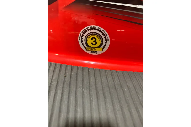 Slide: The Image of 2007 Kawasaki Jet Ski Ultra 250X with capacity sticker on red body. - 9