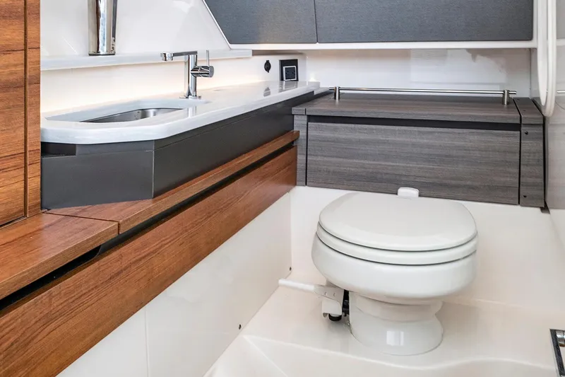 Slide: The Image of Luxurious bathroom in 2027 Tiara Yachts 34 LX, featuring modern sink and toilet. - 17
