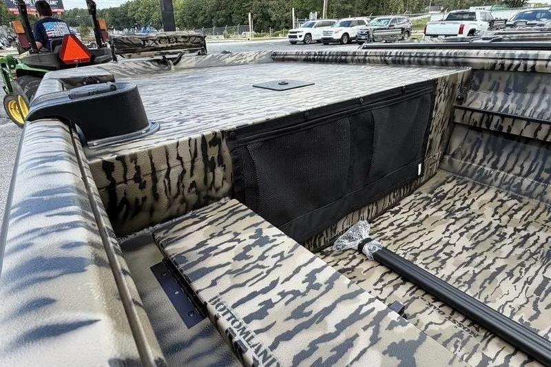 Slide: The Image of 2027 Excel 1751 Viper F4 boat interior with camouflage design and storage compartments. - 14