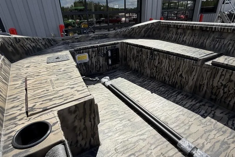 Slide: The Image of 2027 Excel 1751 Viper F4 boat interior with camouflage design and storage compartments. - 11