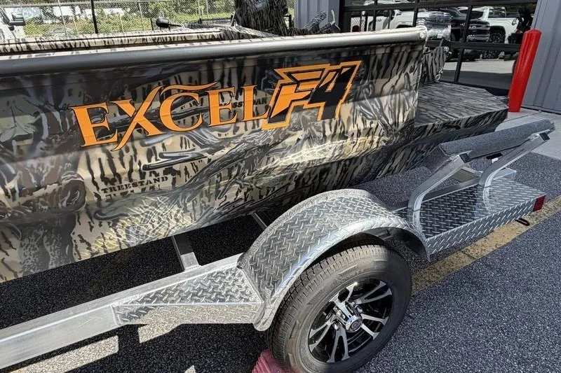 Slide: The Image of 2027 Excel 1751 Viper F4 boat with camouflage design on a trailer. - 15