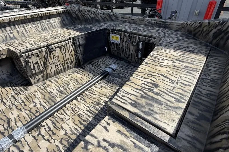 Slide: The Image of Interior of 2027 Excel 1751 Viper F4 boat with camouflage design and storage compartments. - 19