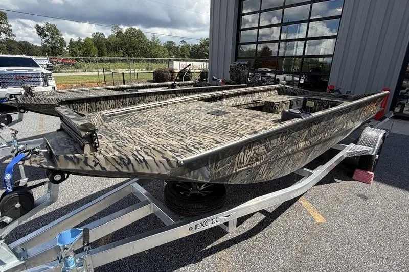 Slide: The Image of 2027 Excel 1751 Viper F4 boat with camouflage design on a trailer. - 18