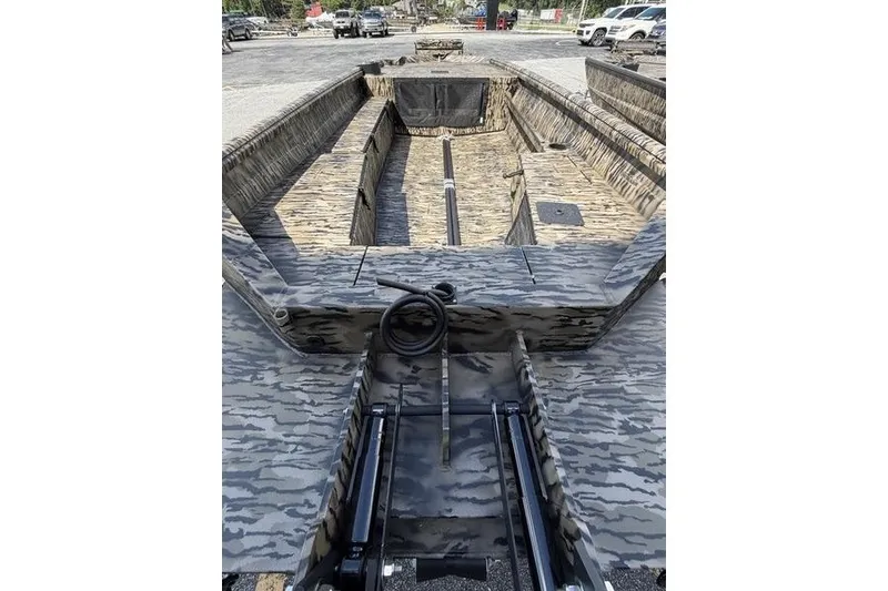 Slide: The Image of 2027 Excel 1751 Viper F4 boat interior with camouflage design, featuring spacious seating and storage. - 12
