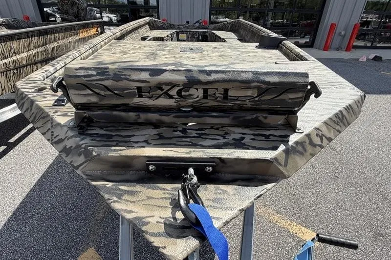 Slide: The Image of Excel 1751 Viper F4 boat, 2027 model, with camouflage design on display outdoors. - 9