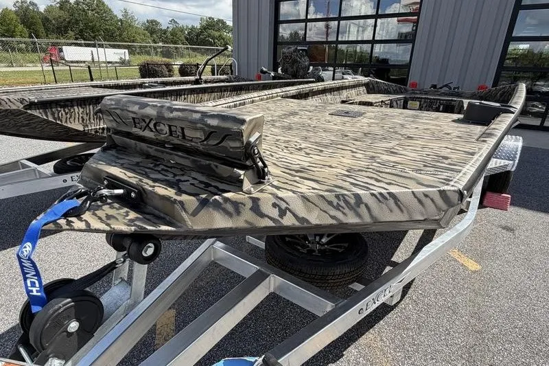 Slide: The Image of 2027 Excel 1751 Viper F4 boat on trailer, featuring camouflage design and sturdy build. - 3