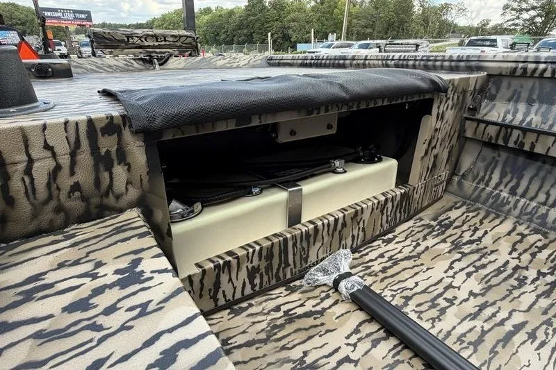 Slide: The Image of 2027 Excel 1751 Viper F4 boat interior with camo design and storage compartment. - 10