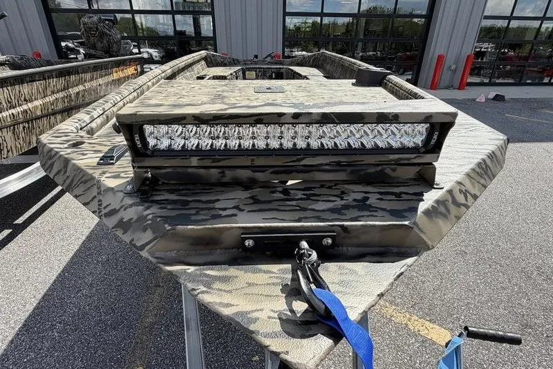 Slide: The Image of Camouflage-patterned 2027 Excel 1751 Viper F4 boat with LED light bar, parked outdoors. - 8