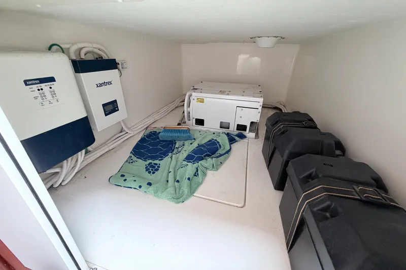 Slide: The Image of Interior of 2023 NorthCoast 285 Cabin showing electrical equipment and storage. - 17