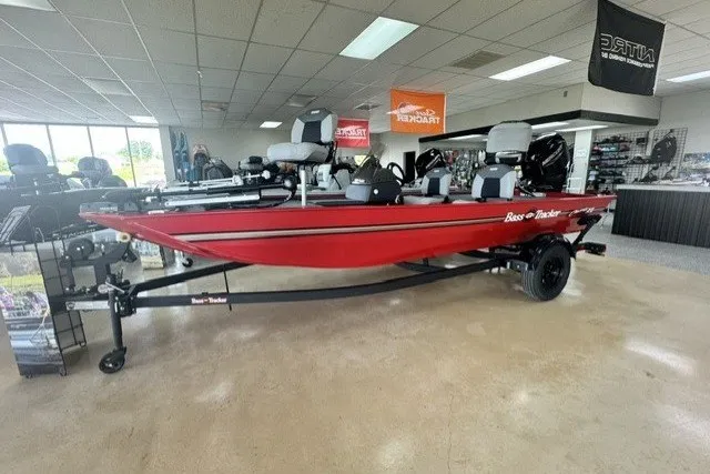 The Image of 2027 Tracker Bass Tracker Classic XL boat in showroom, red exterior, on trailer. - 1