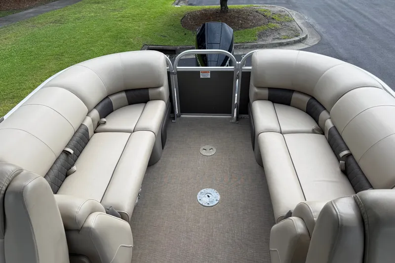 Slide: The Image of 2023 Sun Tracker Party Barge 22 XP3 interior with plush seating and spacious layout. - 18