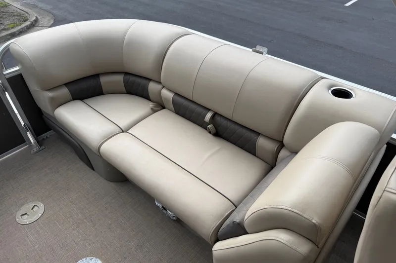 Slide: The Image of 2023 Sun Tracker Party Barge 22 XP3 beige seating with cup holder on pontoon boat. - 20