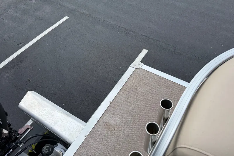 Slide: The Image of 2023 Sun Tracker Party Barge 22 XP3 pontoon boat deck with rod holders. - 23