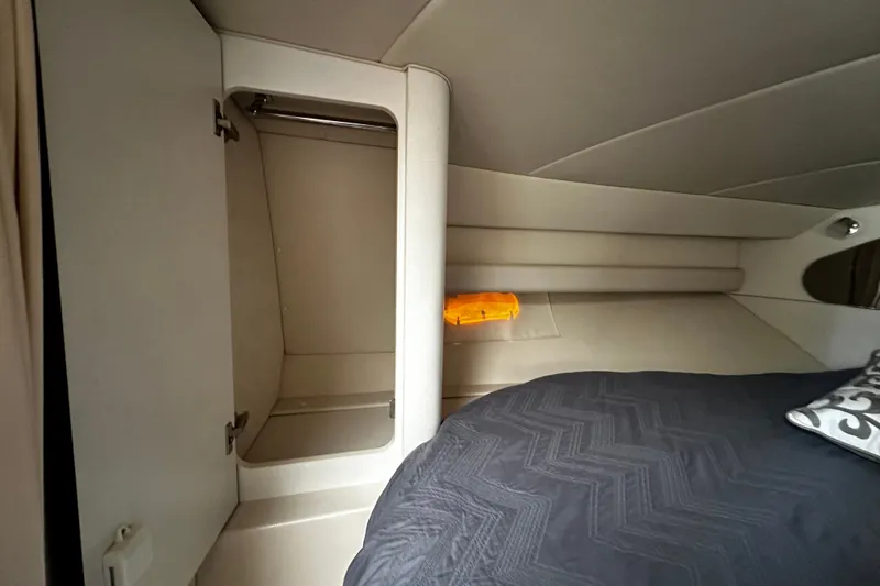 Slide: The Image of Interior cabin of 1997 Cruisers Yachts 337 Esprit with bed and storage. - 11