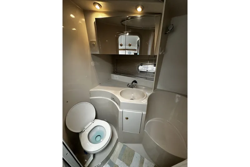 Slide: The Image of Bathroom interior of 1997 Cruisers Yachts 337 Esprit with toilet, sink, and mirror. - 17