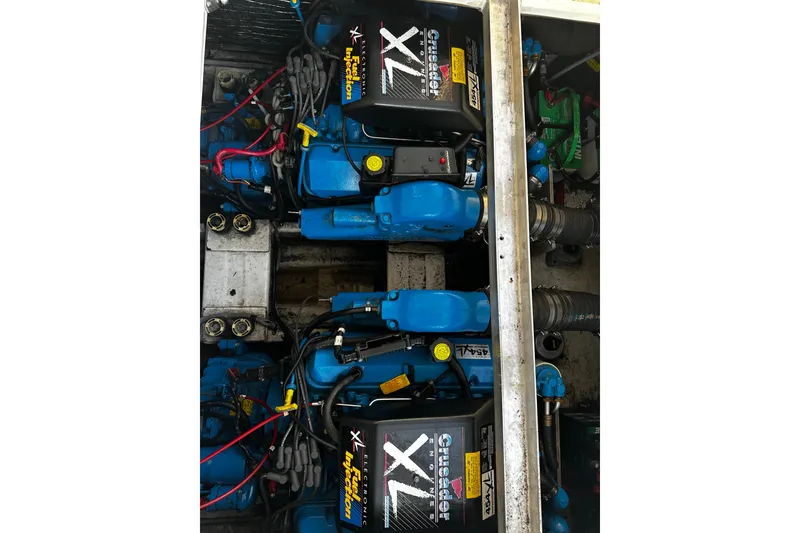 Slide: The Image of Engine compartment of a 1997 Cruisers Yachts 337 Esprit, featuring Crusader XL engines. - 22