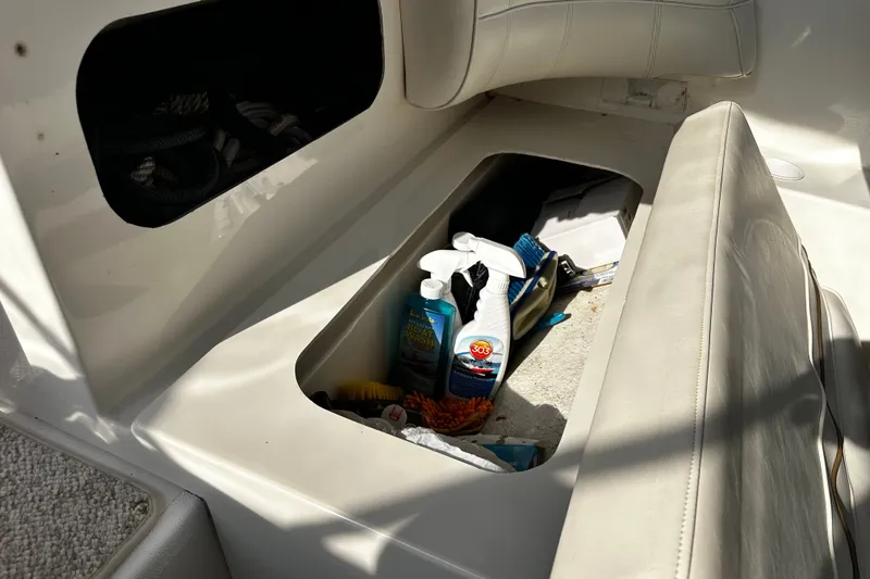 Slide: The Image of Storage compartment on a 1997 Cruisers Yachts 337 Esprit with cleaning supplies. - 7