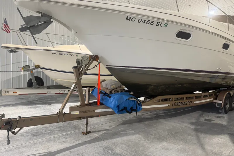 Slide: The Image of 1997 Cruisers Yachts 337 Esprit on Loadmaster trailer in storage facility. - 30