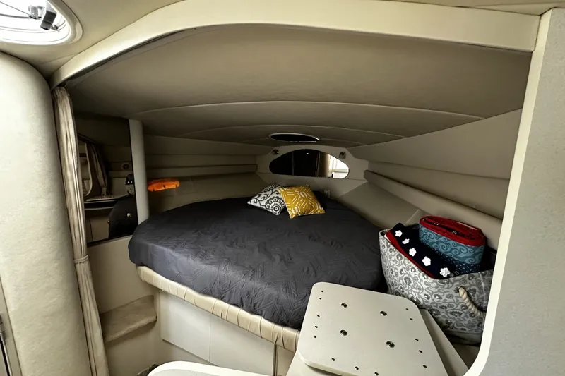 Slide: The Image of Cozy cabin interior of 1997 Cruisers Yachts 337 Esprit with bed and decorative pillows. - 12