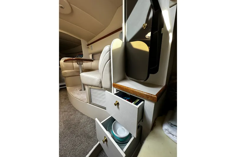 Slide: The Image of Interior of 1997 Cruisers Yachts 337 Esprit with seating and storage drawers. - 14