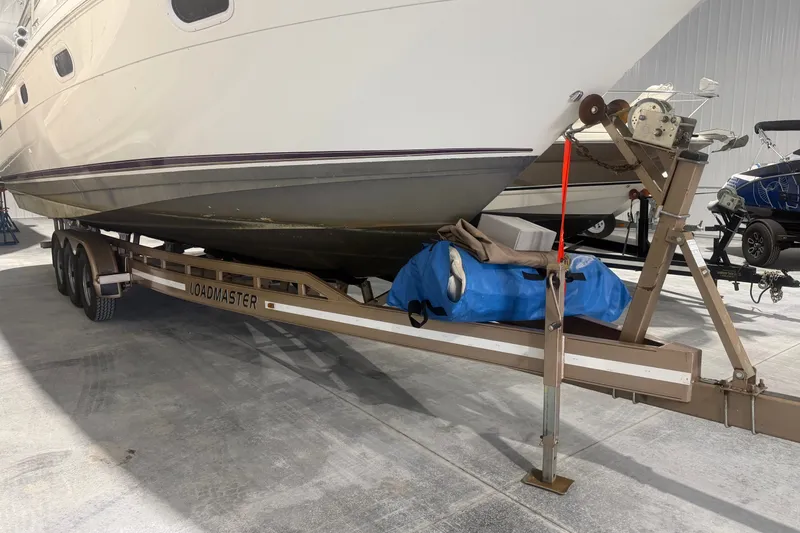Slide: The Image of 1997 Cruisers Yachts 337 Esprit on Loadmaster trailer in storage facility. - 28