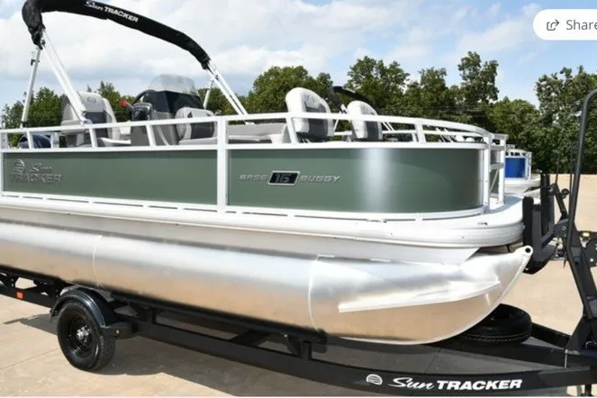 The Image of 2027 Sun Tracker Bass Buggy 16 XL Select pontoon boat on trailer, side view. - 1